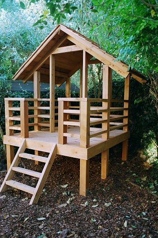Western red cedar play house with porch and cedar shingle roof